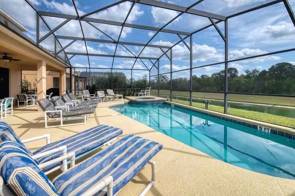 South-facing pool/spa, lanai over looking conservation area and water body