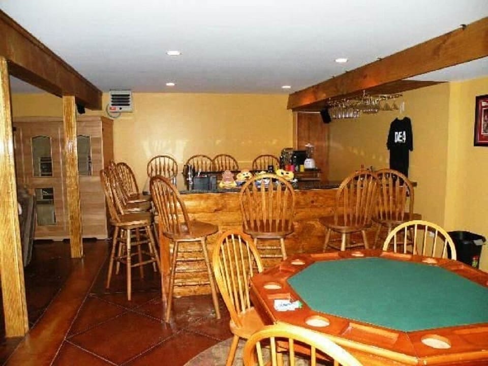 large rustic bar  seats 12,card table,multiple speakers 4tv,stereo,modern sauna 