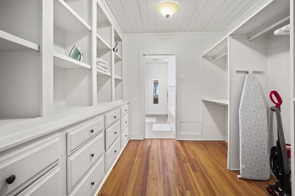 Primary bedroom walk-in closet