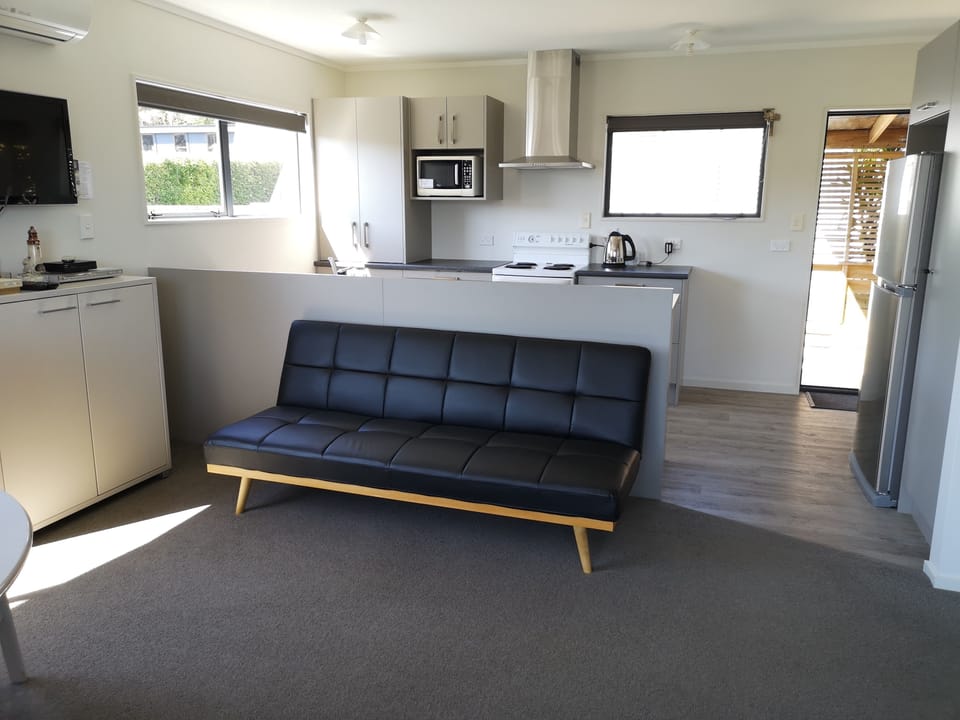 Sofa Bed and kitchen.