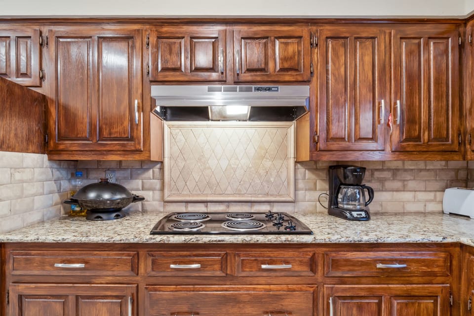 Updated kitchen with beautiful granite countertops and new backsplash