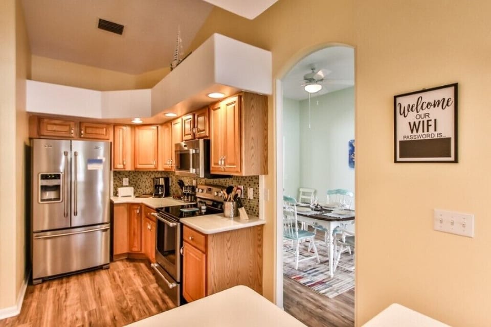 View of the kitchen looking into the formal dining area  that seats 6 people.