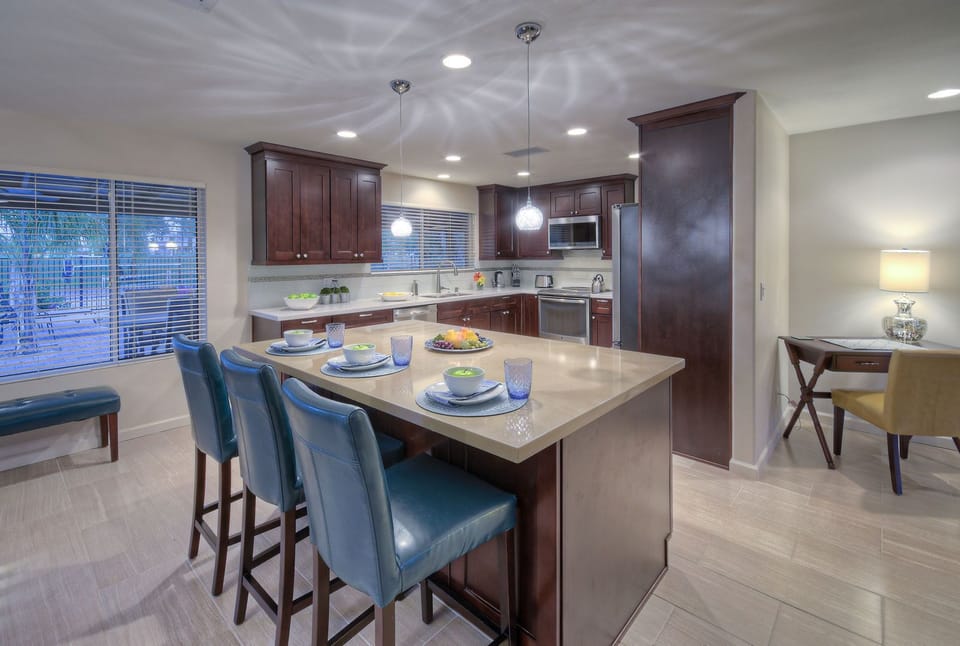 Kitchen is bright and cheerful place to prepare mouthwatering feasts and there is a corner desk for remote work.