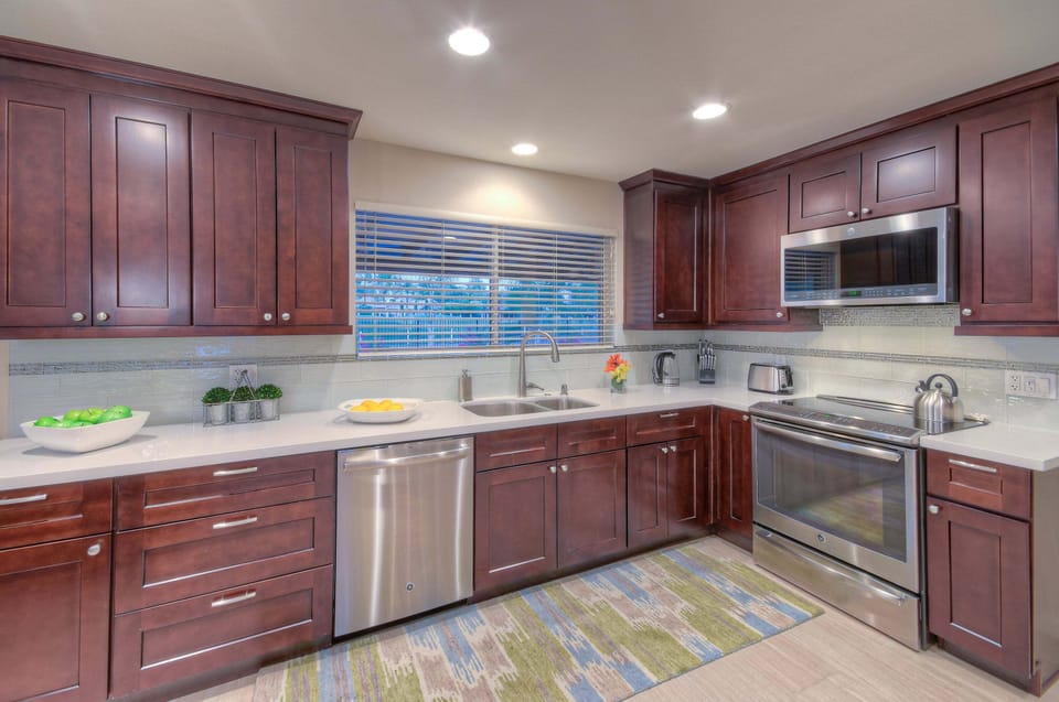 Chef and helpers will love the bright and cheerful kitchen with a backyard view.