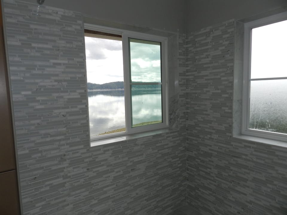 View of the Canal from the shower and tub. New marble and glass mosaic tile!