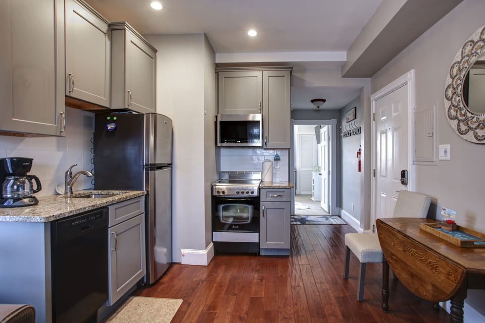 Fully equipped kitchen at the Rose with modern appliances and coastal charm.
