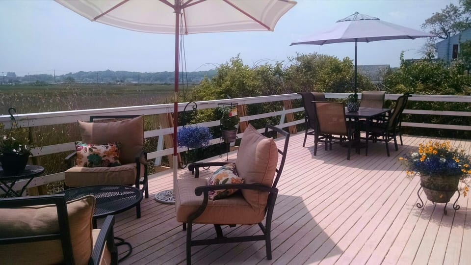Summer view of deck.  Recently upgraded seating.