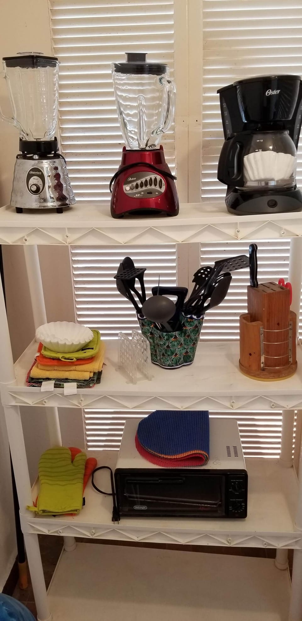 West side of pantry with appliances and cookware, microwave is on counter