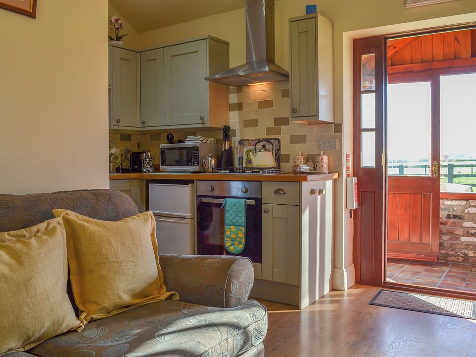 Delightful living room and adjacent kitchen | The Old Chapel, Hempholme, near Brandesburton