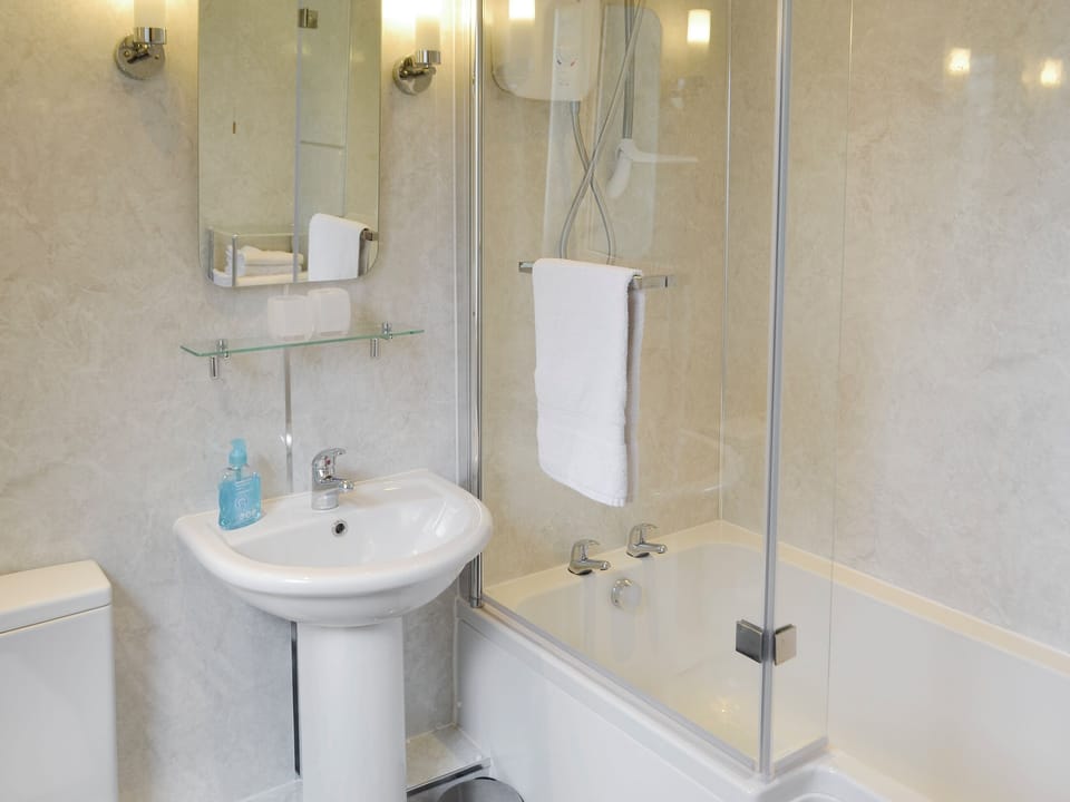 Family bathroom with shower over bath | Oak Cottage - Whitelee Farm, Bryness, near Otterburn