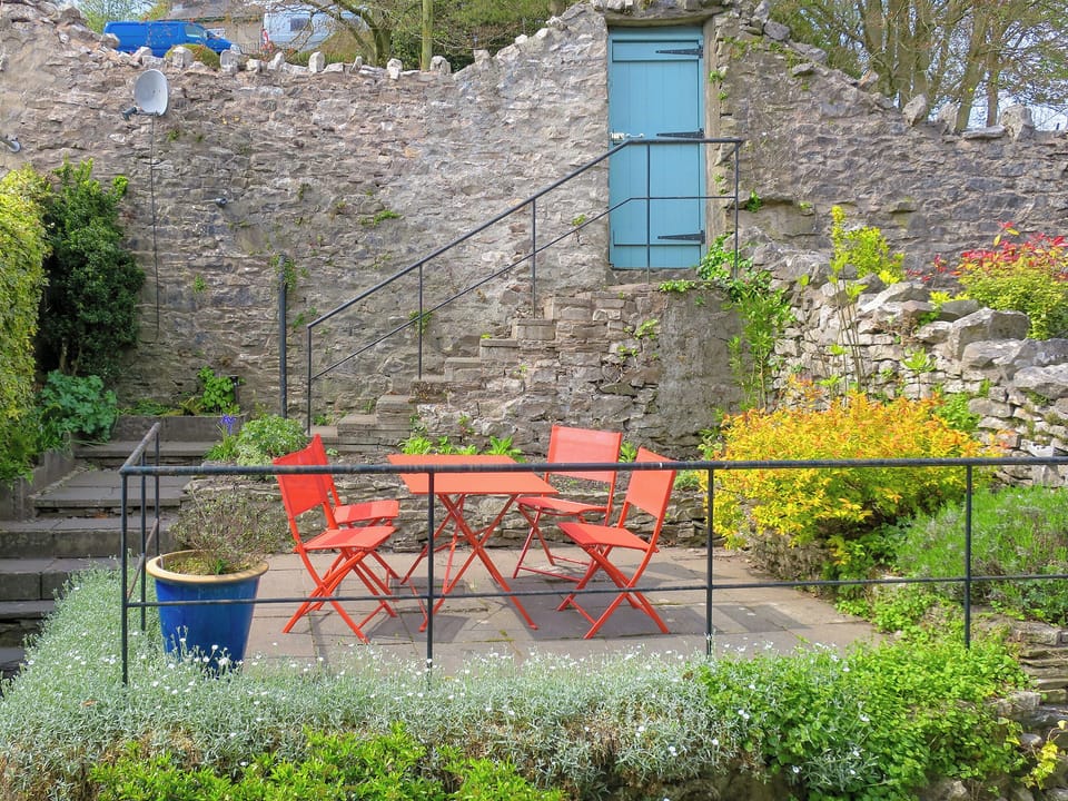 Private terraced garden with table and chairs | Beech Hill, Kendal