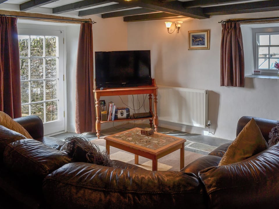 Lovely living room with beamed ceiling | Purlinney - Trebarwith Farm Cottages, Trebarwith, Delabole