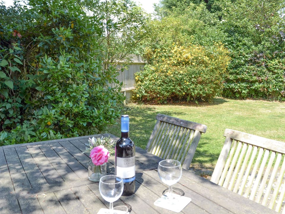Tranquil outdoor seating area within garden | Chessons FarmStable Cottage, Wadhurst, near Tunbridge Wells