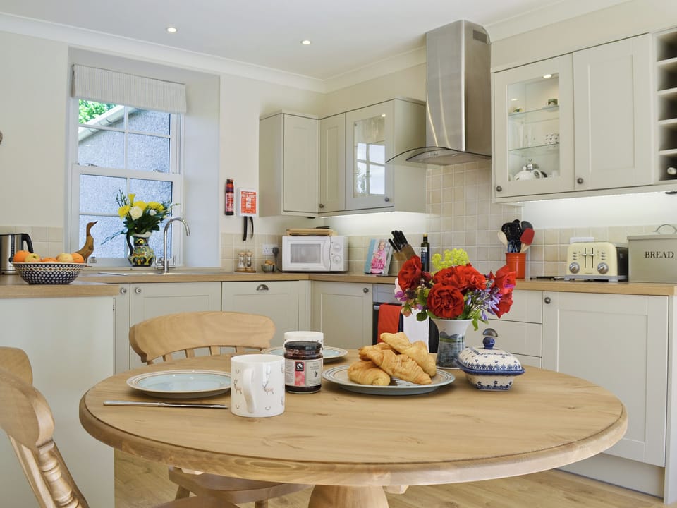 Well-equipped country style kitchen and dining area | Curlew Cottage - Strathisla Farm Cottages, Meigle