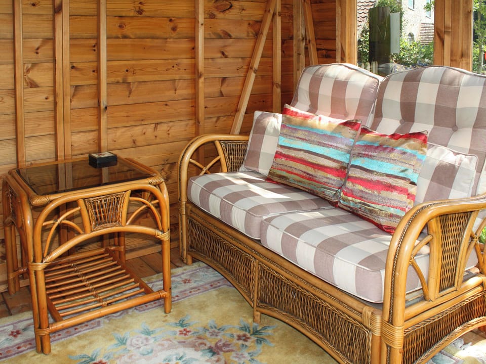 Comfy seating within the summerhouse | Churchview House, Winterbourne Abbas, near Dorchester