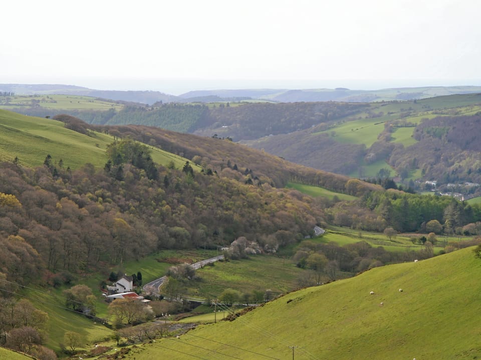 The road winds down into the valley below | Tŷ Melindwr, Hen Goginan, near Aberystwyth