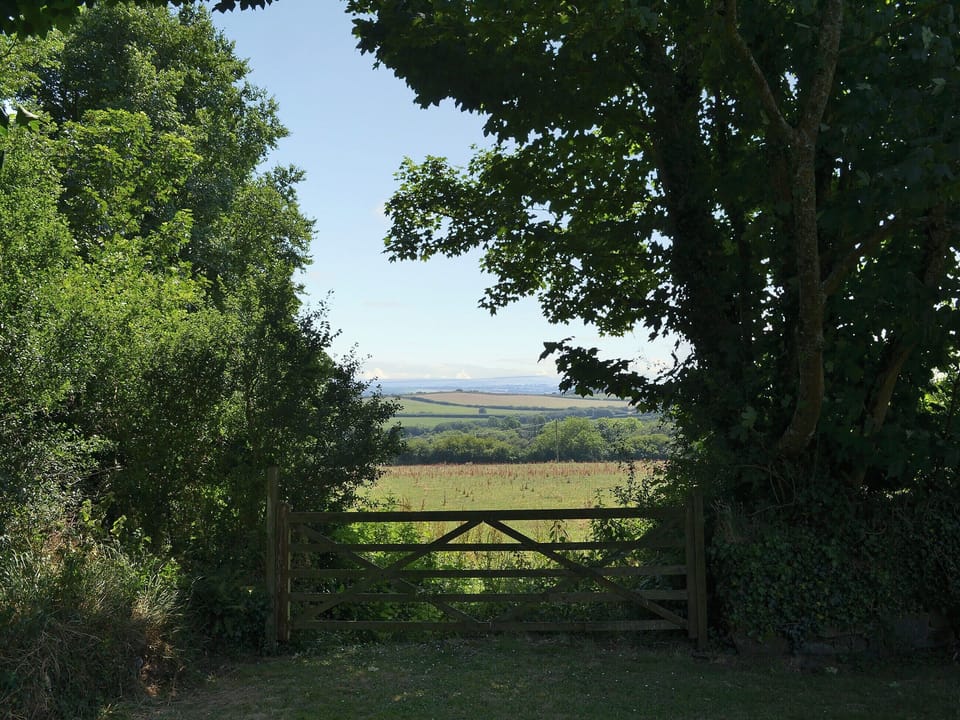 Admire the rolling Cornish countryside from the bottom of the garden | Coachmans Retreat, Pennytinney, St Kew