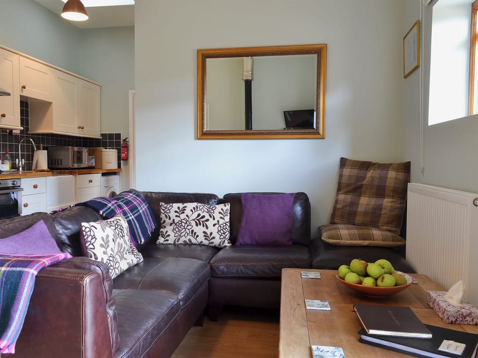 Living room with wood-burning stove | The Stables - Higher Farm, Martin, Fordingbridge