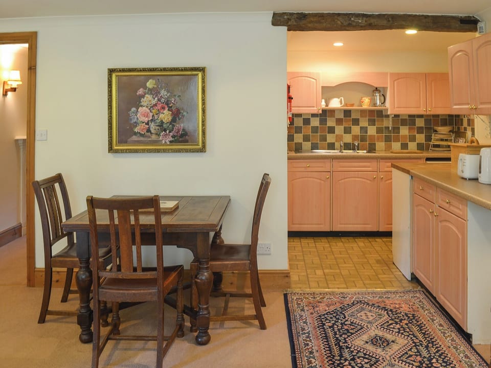 Modest dining area and adjacent kitchen | Burrow Farm Garden Retreat - Gardener&rsquo;s Rest - Burrow Farm Gardens Retreat, Dalwood, near Axminster