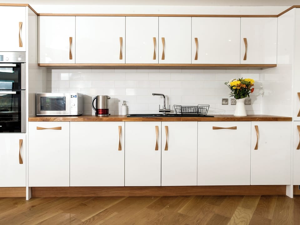 Well-equipped fitted kitchen | Strathspey Lodge, Duthil, Carrbridge, near Aviemore