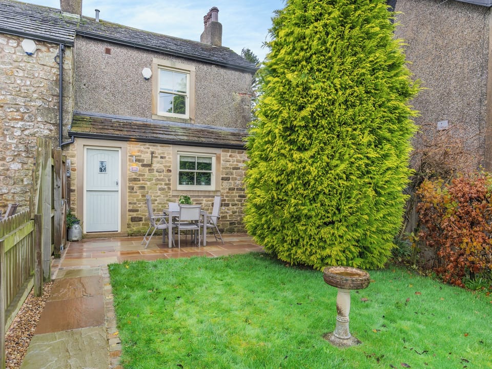 Small enclosed garden with patio and garden furniture | Meresyke Farm - Adair Cottage - Mere Syke Farm, Wigglesworth, near Settle