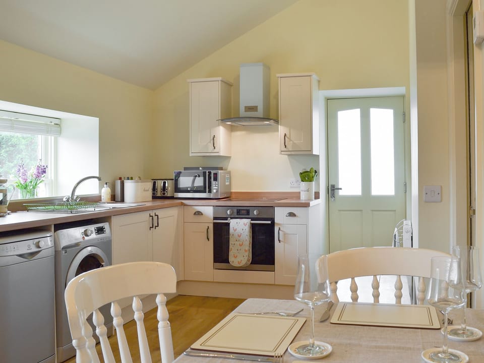 Well equipped kitchen/ dining area | Alphin Apartment, Mossley