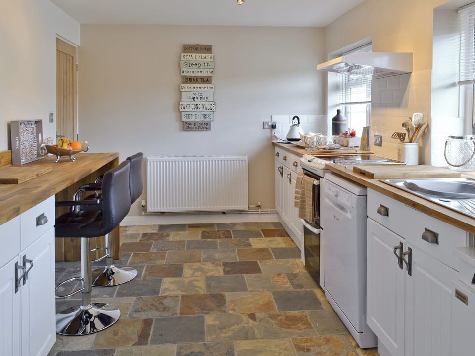 Well-appointed kitchen with breakfast bar and stools | Willow Tree Cottage at Cottage Farm - Cottage Farm, Foxholes, near Scarborough