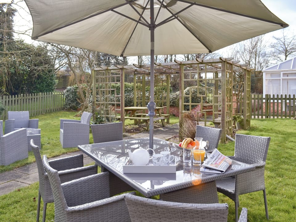 Garden accommodating both outdoor eating and seating areas | Willow Tree Cottage at Cottage Farm - Cottage Farm, Foxholes, near Scarborough