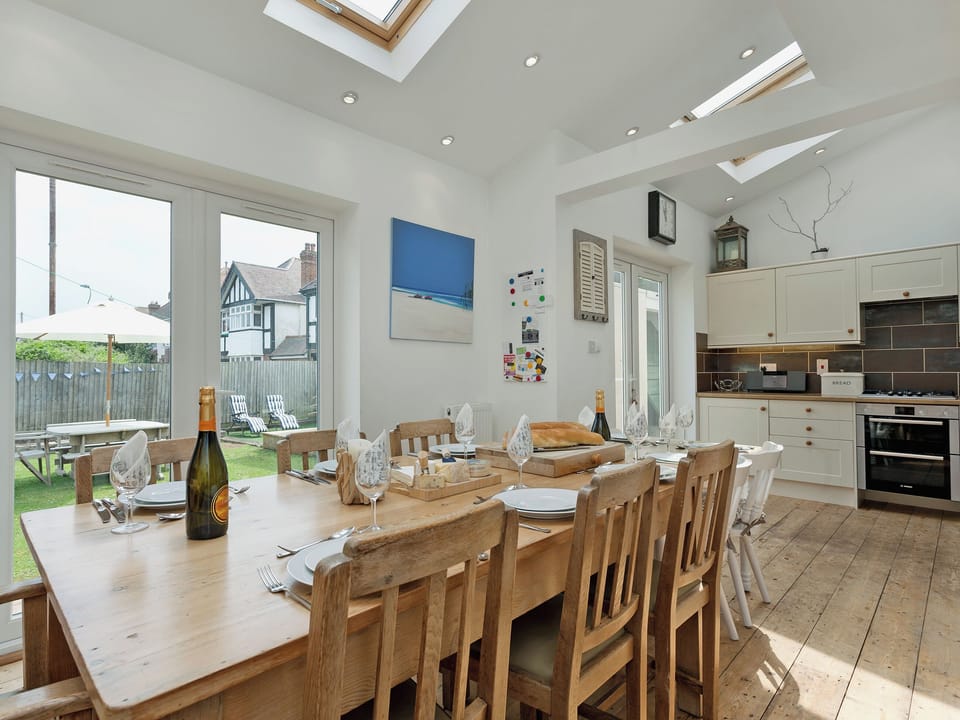 Spacious kitchen/dining room with doors leading to the garden | Stourcliffe House, Bournemouth
