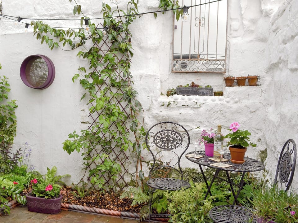 Enclosed courtyard with garden furniture | Larkspur, St Leonards-on-Sea, near Hastings