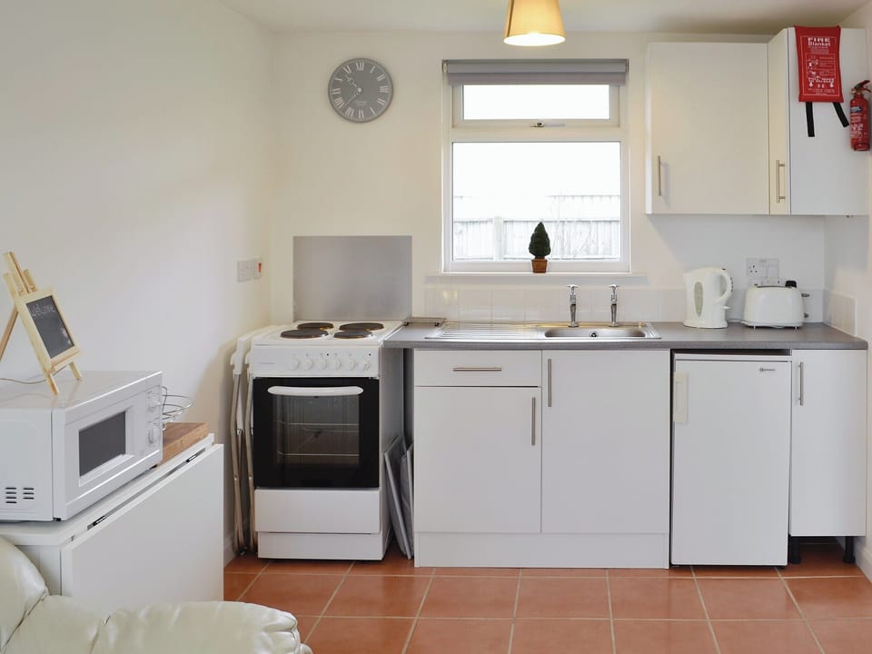 Quaint open plan living space | Chalet One, Bridport