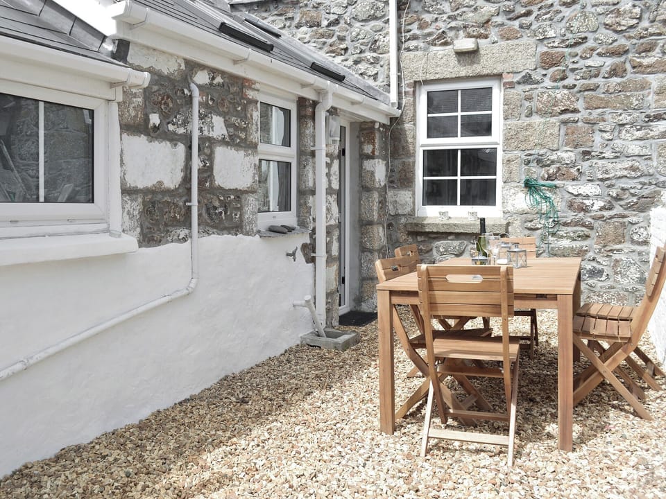 Peaceful patio area | Morvoren (Sea Maiden) Cottage, The Lizard Village, near Helston