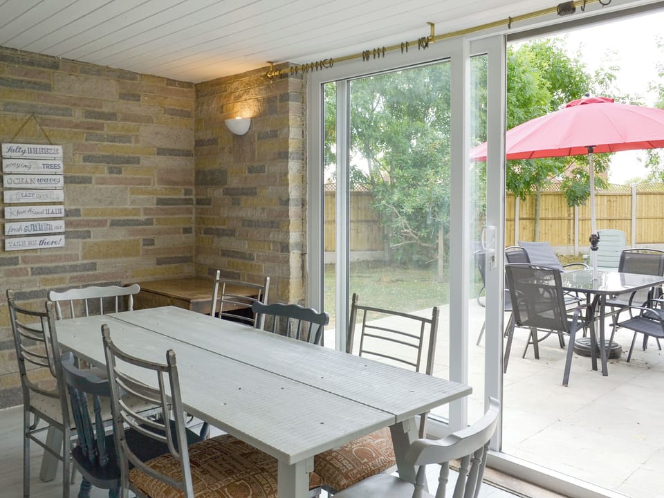 Dining room with patio door to garden | Golf Road, Mablethorpe, near Skegness