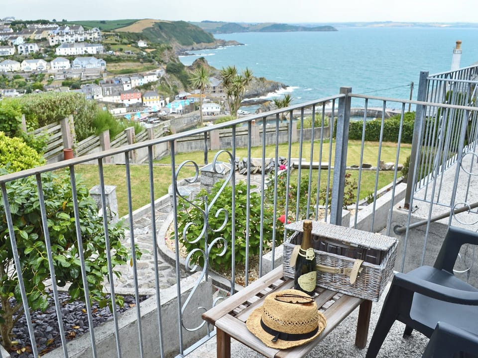 Realxing patio with amazing coastal views | Lowenna - Polhaun Holiday Apartments, Mevagissey, near St Austell