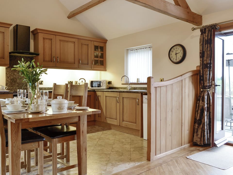 Fully appointed kitchen with dining area | The Old Byre - West House Farm, Dearham, near Maryport