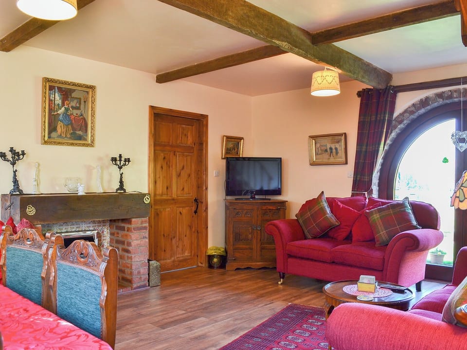 Charming beamed living area with patio doors to the garden | Acorn Barn, Laytham, near York