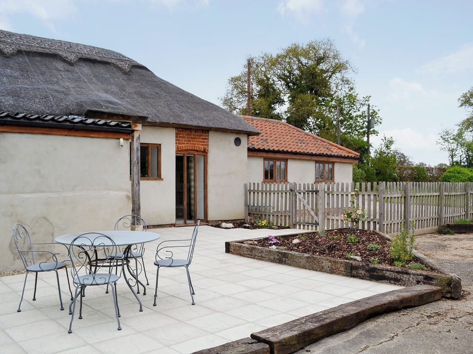 Relaxing sitting-out-area with furniture | The Cowshed, Blofield, near Norwich