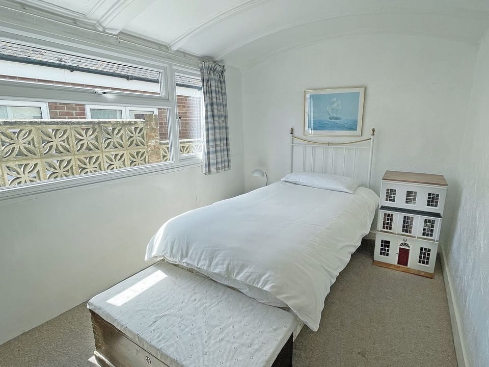 Fourth (single) bedroom with doll&rsquo;s house | Thalassa, Pagham, near Chichester