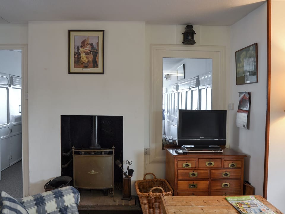 Living room with wood burner | Thalassa, Pagham, near Chichester
