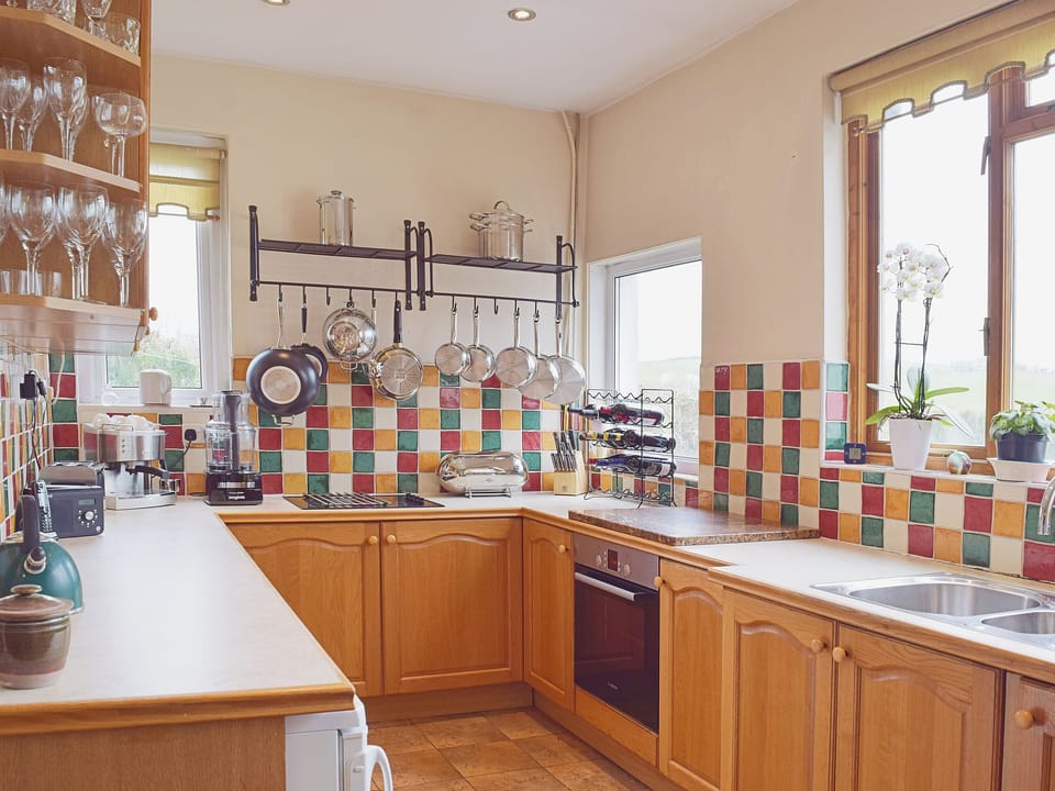 The galley-style kitchen has all the features and appliances you could wish for | Tan Y Castell, Llanmill, near Narberth