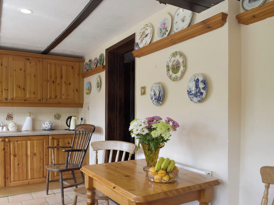 Intimate dining area within kitchen | Tillet Cottage, Oulton Broad, near Lowestoft