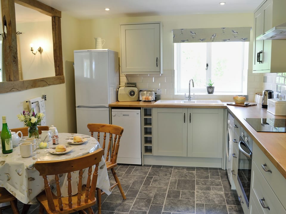Beautifully presented kitchen/dining room with beams | Acorn Cottage - Wood Dairy, North Perrott, near Crewkerne