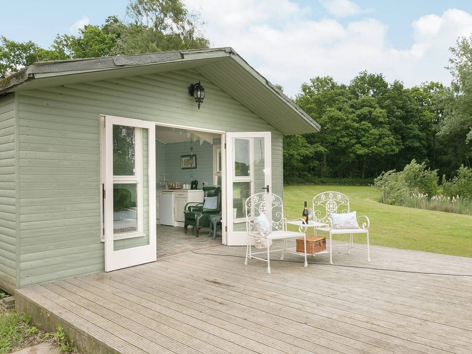 Sit out on the decking and enjoy a glass of wine | Yokefleet Cottage, Sandholme, near Beverley