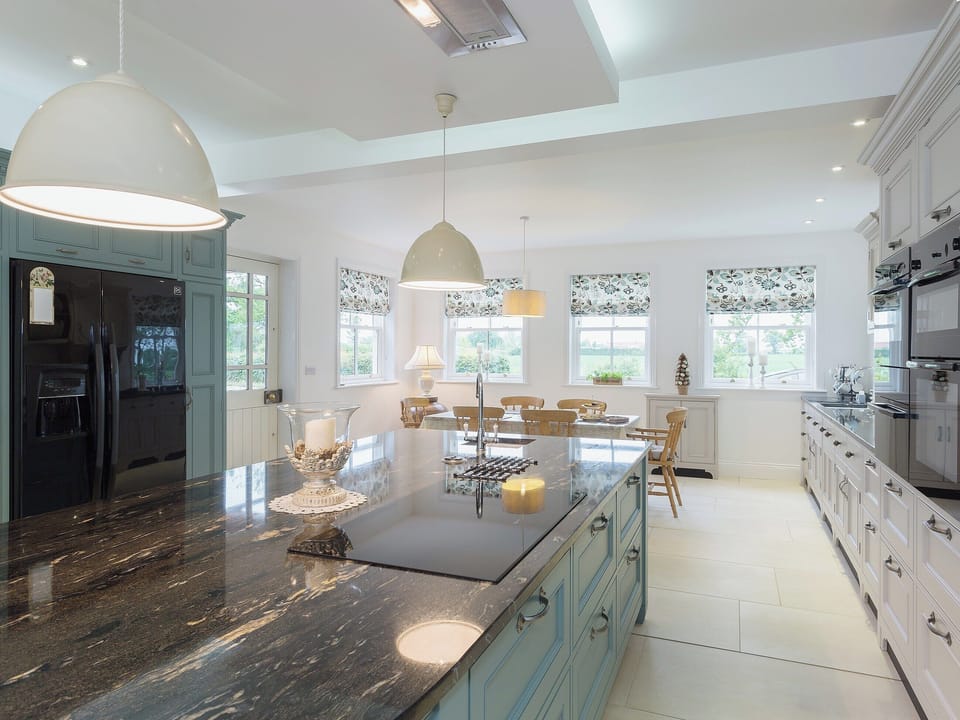 Luxurious kitchen with marble worktops and induction hob | Yokefleet Cottage, Sandholme, near Beverley
