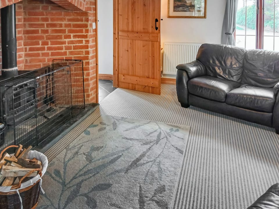 Inviting living room with wood burner | Beckaveans Granary - Beckaveans, Jacobstow, near Bude