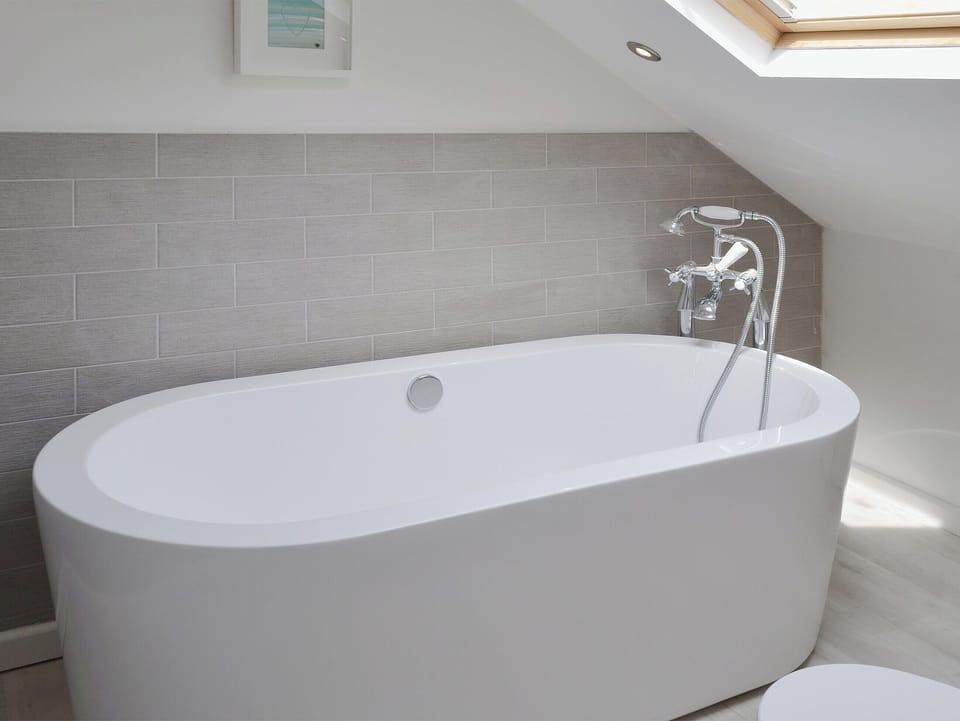 Contemporary standalsone bath in the en-suite | Abbeydale Town House, Whitby
