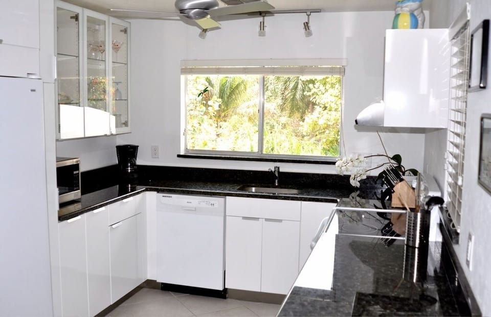 The kitchen with pull out cabinets/drawers, granit counter and grant countertops