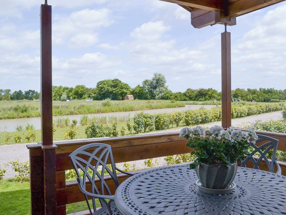 Spectacular views from the veranda | Hazel Lodge - Faulkers Lakes, Burgh le Marsh, near Skegness
