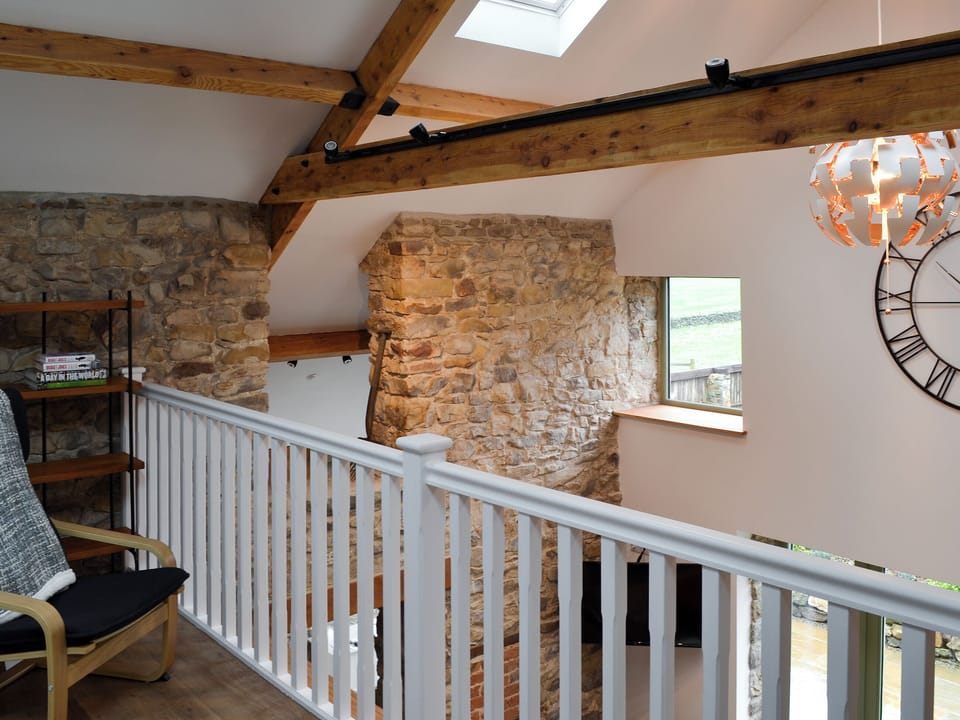 Galleried reading area overlooking the living room | The Barn, Harwood Dale, near Scarborough