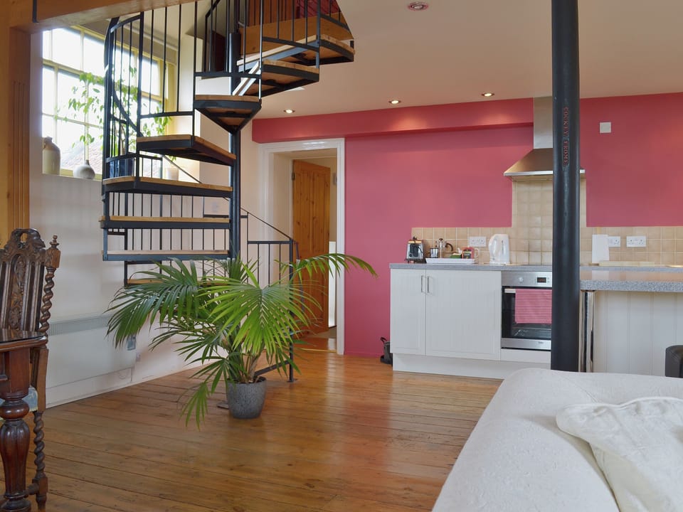 The polished wood fllors reflect the grandeur of the living space | Little Burcott Loft, Burcott, Wells